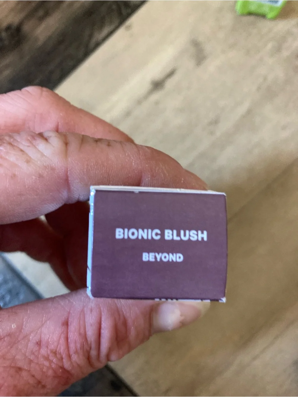 Milk Makeup lipstick packaging in white and burgundy with mint label